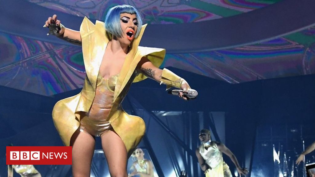 Lady Gaga plummets off stage in a fan's arms during Vegas show - BBC News